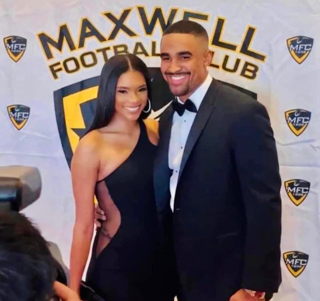 Bry Burrows with her partner in a football players party