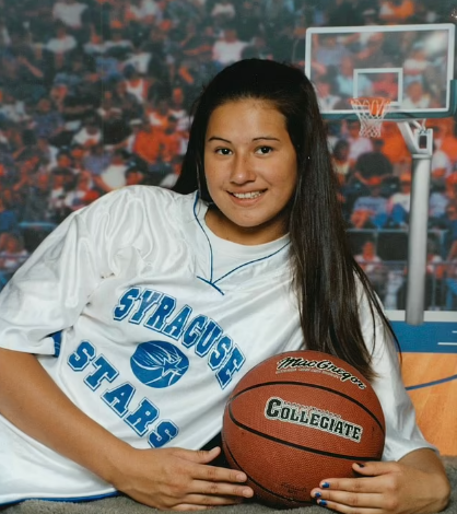 Marie Temara playing basketball in her college time