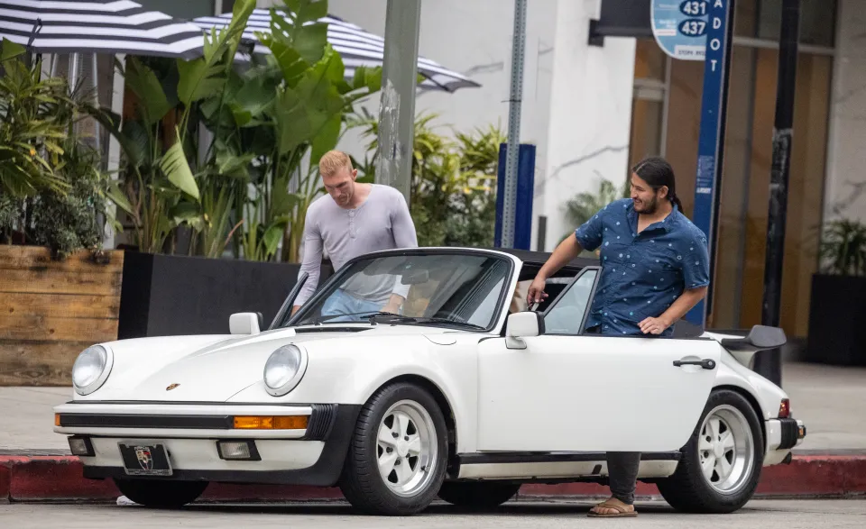 Edwin Castro in his new vintage car