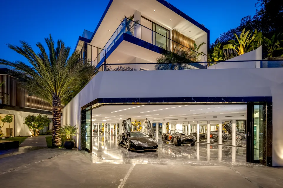 Edwin Castro new luxurious house with supercars in the garage