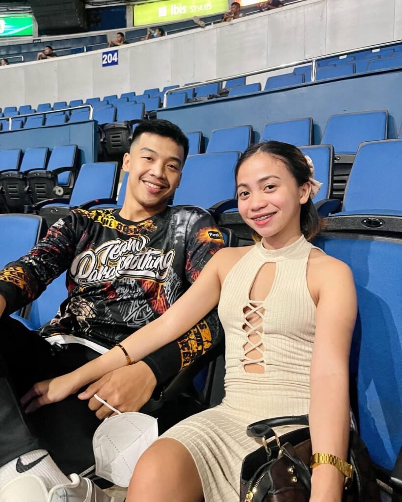 John Amores with his wife at the stadium