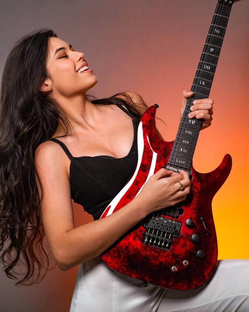 Larissa Liveir with her electrical guitar